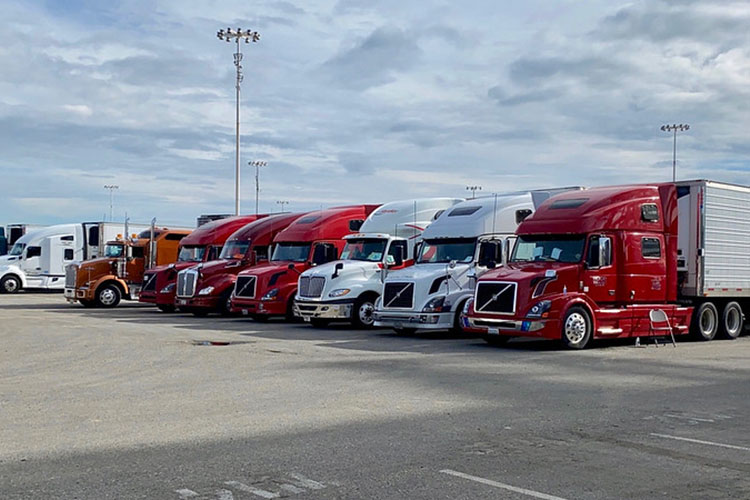 a line of parker tractor trailers