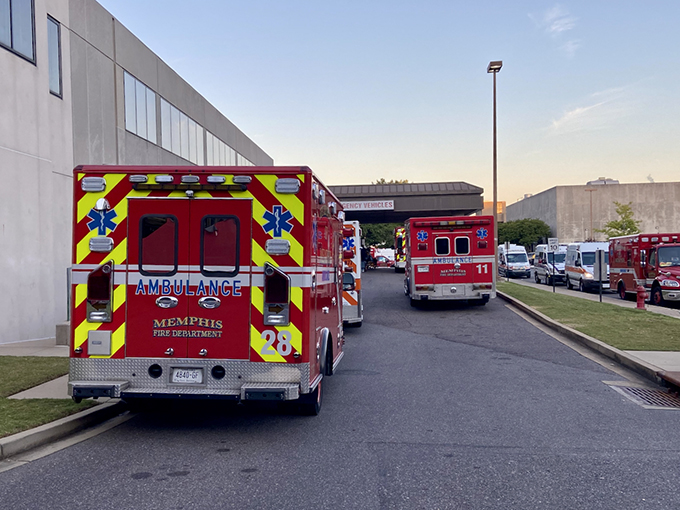 Ambulance vehicles line up outside a Memphis healthcare facility