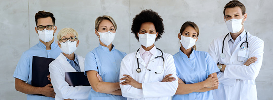 Team of confident medical experts with n95 face masks. 