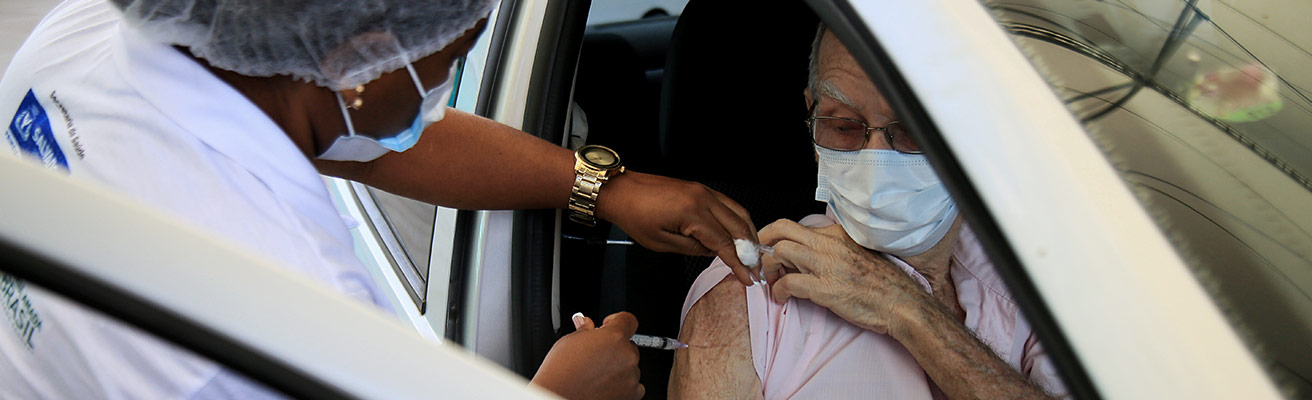 Volunteer administers a vaccine