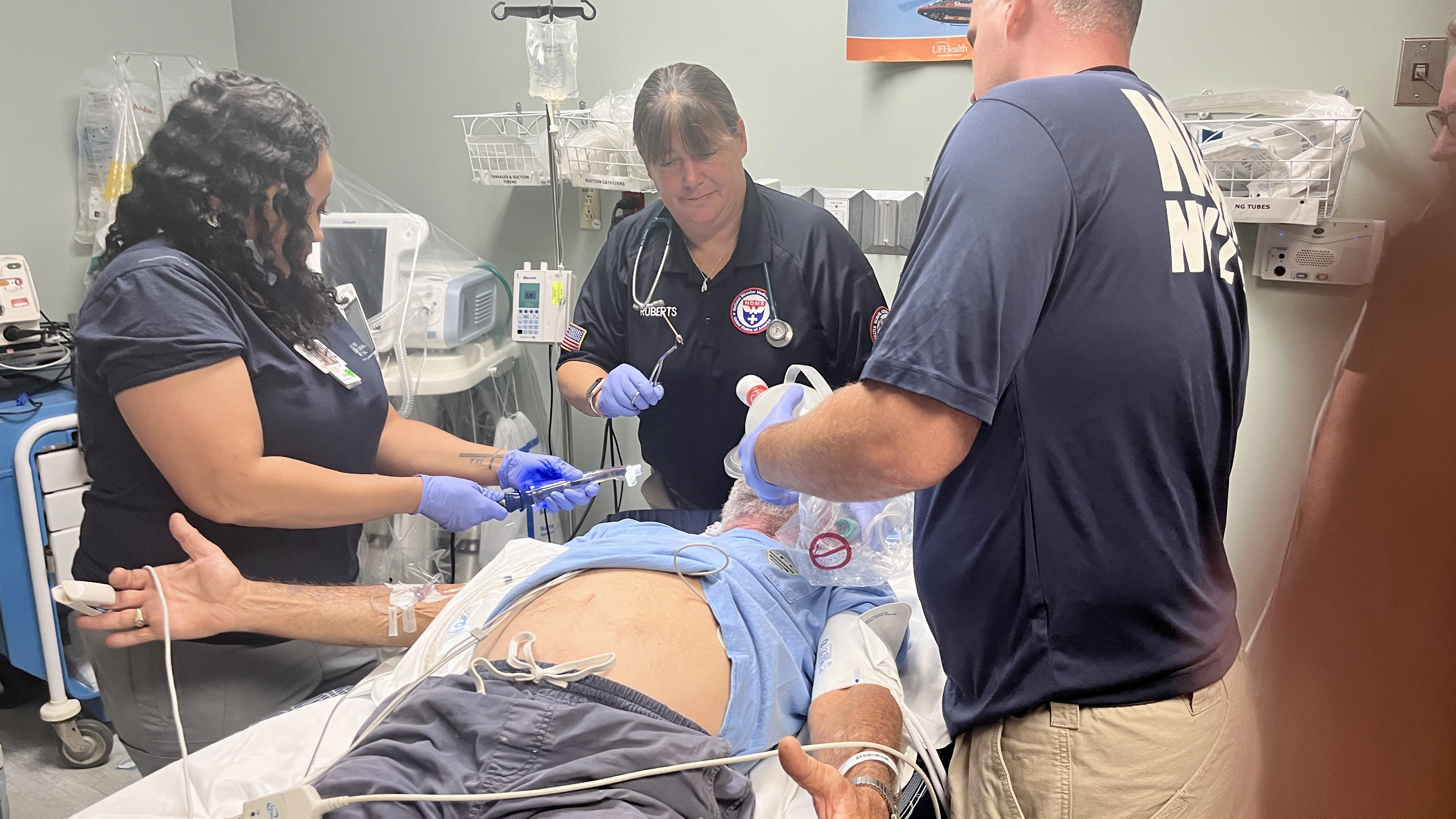 NDMS team treat an elderly patient in the ER
