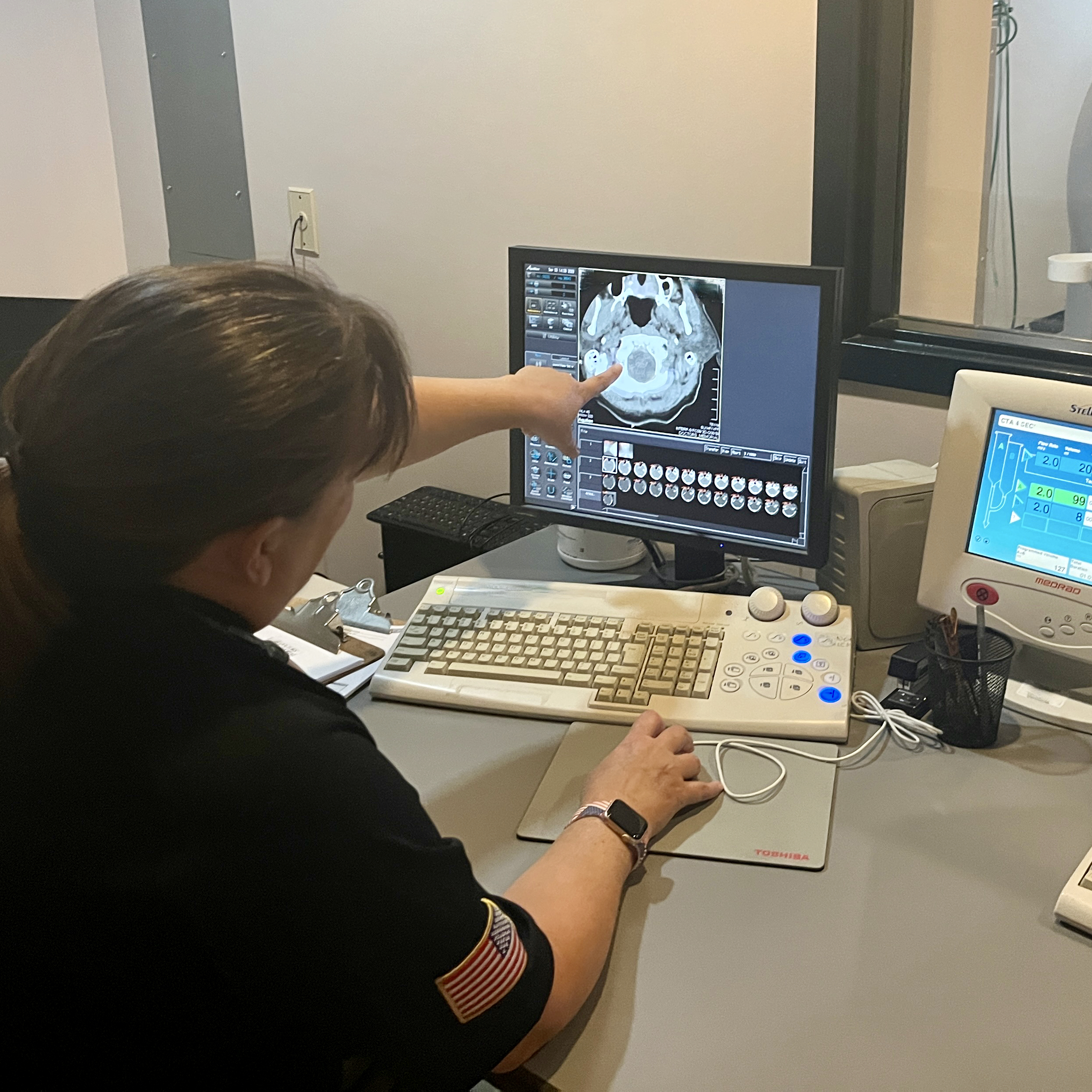NDMS staffer reviews a CT Scan