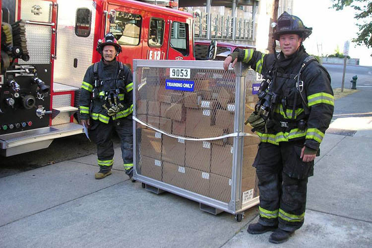 emergency responders with boxes on a pallet