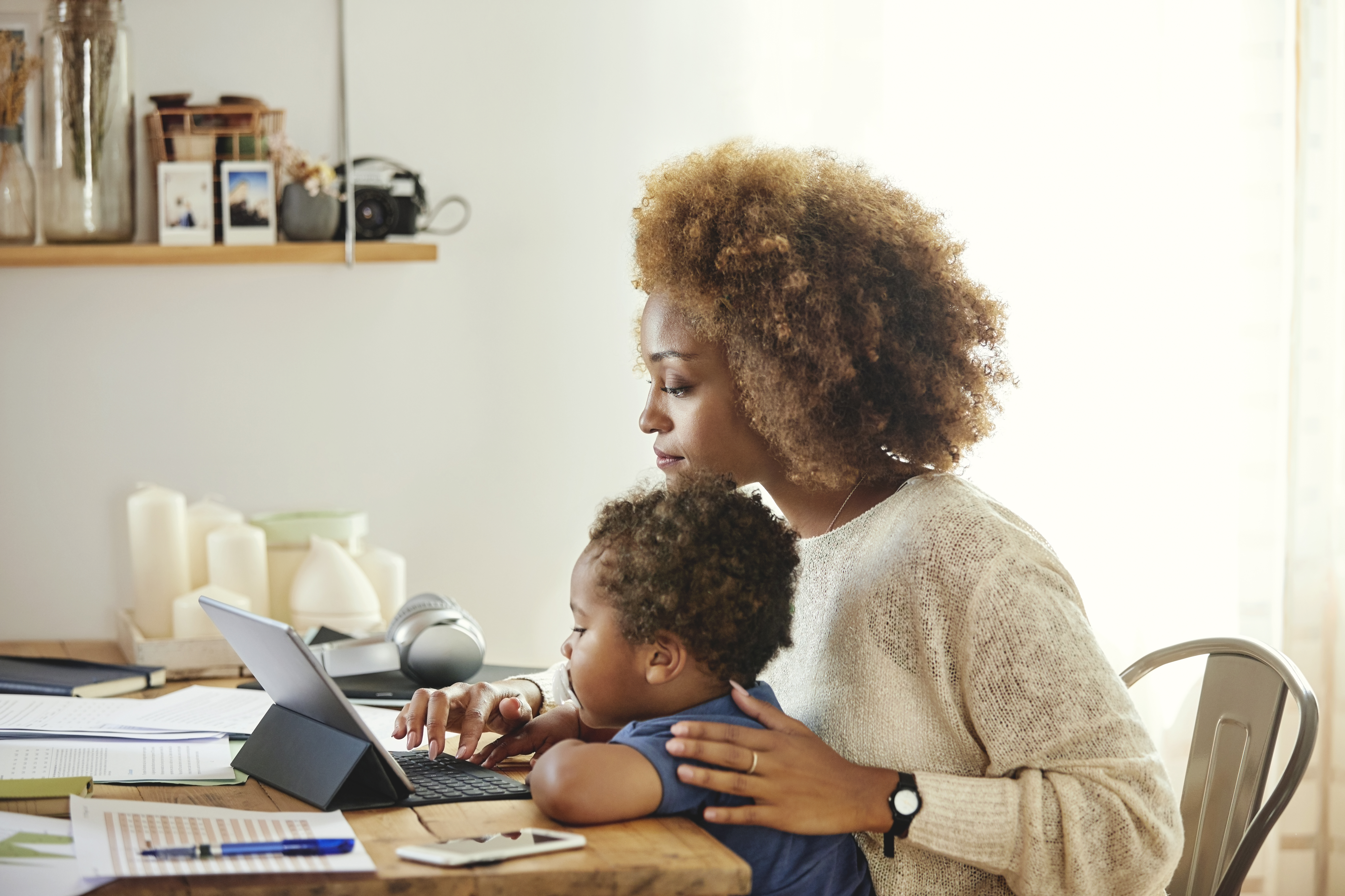 Woman teleworking with child